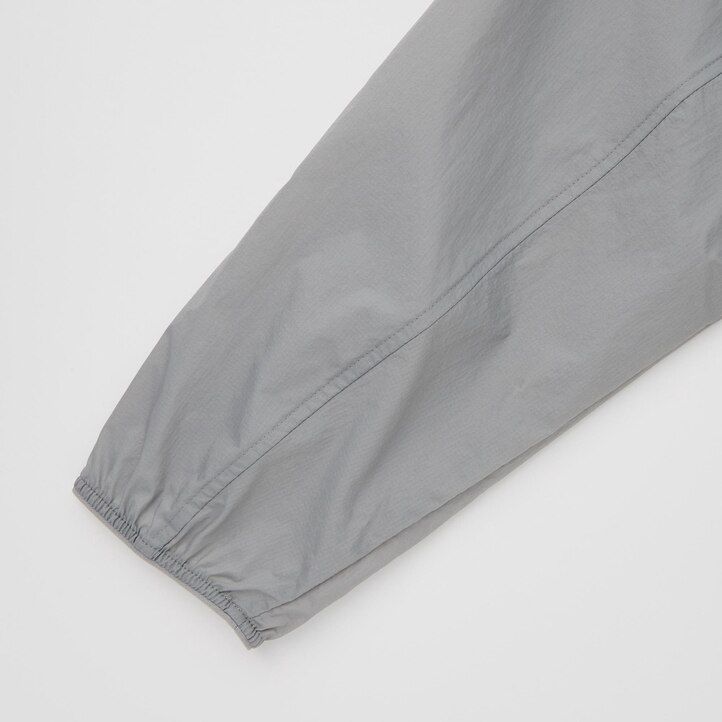 uniqlo uv-schutz-jacke für herren mit tasche orange